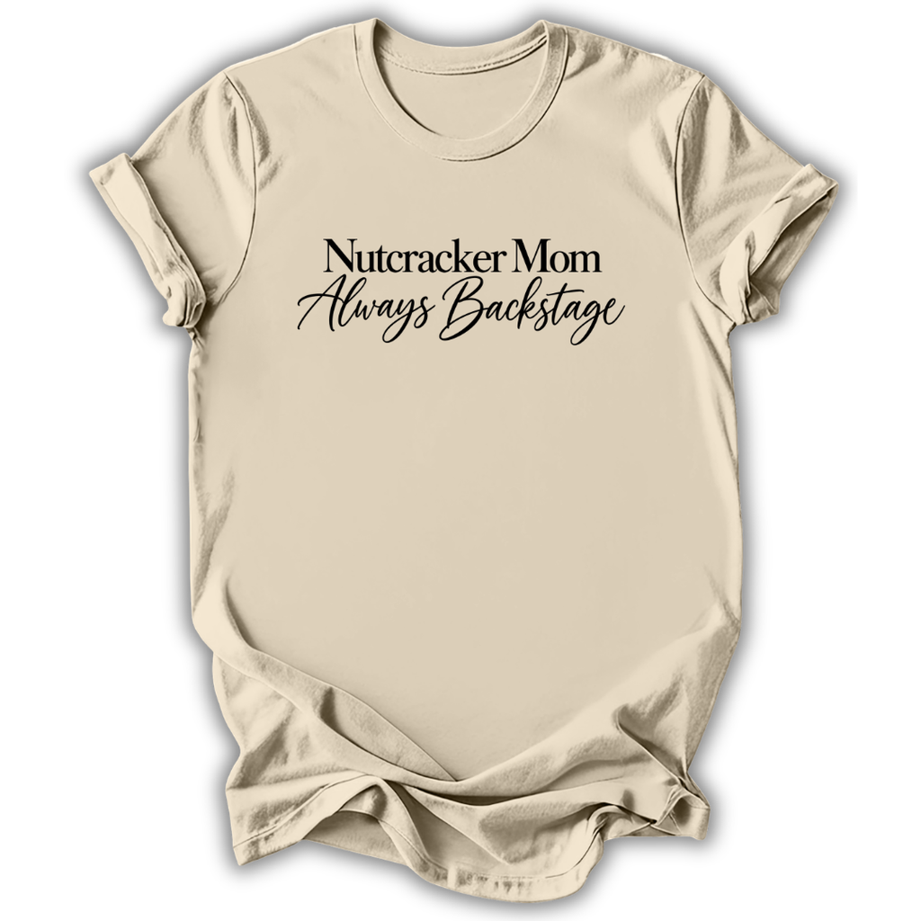 A natural cream short-sleeve t-shirt printed with the “Nutcracker Mom Backstage” graphic design.