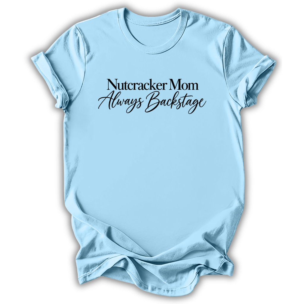 A light blue short-sleeve t-shirt printed with the “Nutcracker Mom Backstage” graphic design.