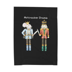 Black blanket with cartoon characters and 'Nutcracker Drama' text on a white background